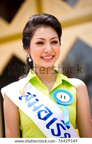 HUA HIN THAILAND - APRIL 29: Miss Hua Hin Contestant No.13 smiles at the camera during round 1 of 2011 Miss Hua Hin Beauty Contest on April 29 2011 at Hua Hin Train Station in Hua Hin Thailand