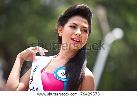 HUA HIN THAILAND - APRIL 29: Miss Hua Hin Contestant No.16 poses for the camera during round 1 of 2011 Miss Hua Hin Beauty Contest on April 29 2011 at Hua Hin Train Station in Hua Hin Thailand