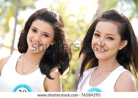 HUA HIN THAILAND - APRIL 29: Two unidentified Miss Hua Hin Contestants pose for camera in round 1 of 2011 Miss Hua Hin Beauty Contest on April 29, 2011 at Anantara Hua Hin Resort and Spa in Hua Hin, Thailand
