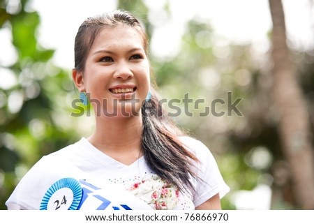 HUA HIN, THAILAND - APRIL 29: Miss Hua Hin Contestant No.24 smiles at the camera in round 1 of 2011 Miss Hua Hin Beauty Contest on April 29 2011 at Anantara Hua Hin Resort and Spa in Hua Hin, Thailand
