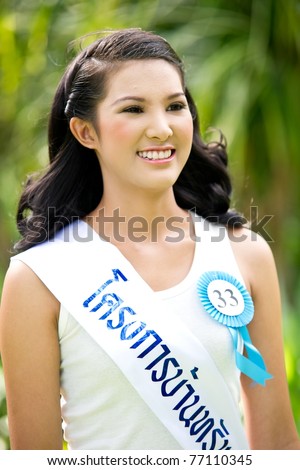 HUA HIN, THAILAND - APRIL 29: Miss Hua Hin Contestant No.33 smiles at photographers in round 1 of 2011 Miss Hua Hin Beauty Contest on April 29 2011 at Anantara Hua Hin Resort and Spa in Hua Hin, Thailand
