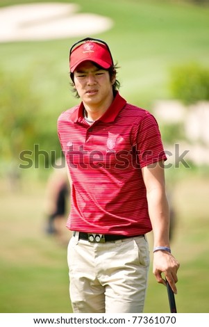 HUA HIN THAILAND - JANUARY 7: Japanese golfer Ryo Ishikawa waits for his turn to putt during Day 1 of The Royal Trophy Europe VS Asia on January 7, 2011 at Black Mountain Golf Club Hua Hin Thailand