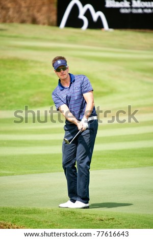HUA HIN, THAILAND - JANUARY 7: Henrik Stenson of Sweden in action during Day 1 of The Royal Trophy tournament, Europe VS Asia on January 7, 2011 at Black Mountain Golf Club in Hua Hin, Thailand