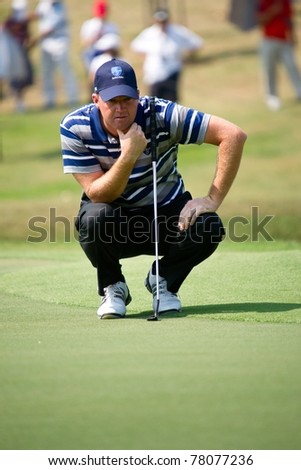 HUA HIN THAILAND - JANUARY 8: Swedish golfer Peter Hanson thinks of his next move on Day 2 The Royal Trophy, Europe VS Asia on January 8, 2011 at Black Mountain Golf Club in Hua Hin, Thailand