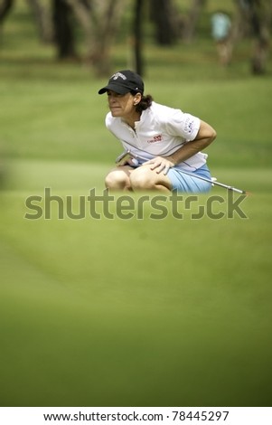 PATTAYA, THAILAND - FEBRUARY 18: American golfer Juli Inkster thinks of her next move during Day 2 of Honda LPGA Thailand on February 18, 2011 at Siam Country Club Old Course in Pattaya, Thailand
