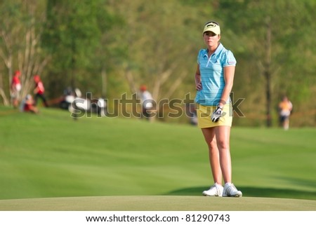 PATTAYA, THAILAND - FEBRUARY 18: US golf player Paula Creamer waits for a turn to putt on Day 2 of Honda LPGA Thailand 2011 on February 18, 2011 at Siam Country Club Old Course in Pattaya, Thailand