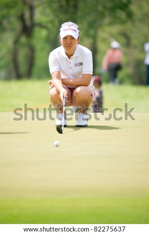 PATTAYA THAILAND - FEBRUARY 20: Japanese player Mika Miyazato thinks of her next move during Day 4 of Honda LPGA Thailand 2011 on February 20, 2011 at Siam Country Club Old Course in Pattaya, Thailand