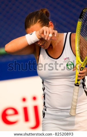 PATTAYA, THAILAND - FEBRUARY 12: Italian player Roberta Vinci wipes sweat off her face during semi final round of PTT Pattaya Open 2011 on February 12, 2011 at Dusit Thani Hotel in Pattaya, Thailand