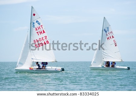 CHA-AM THAILAND - AUGUST 22: Unidentified sailors from Thailand & Myanmar compete on Day 1 of the 2011 Hua Hin Regatta on August 22, 2011 at Dusit Thani Resort & Spa Hua Hin in Cha-Am, Thailand