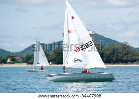 CHA-AM THAILAND - AUGUST 22: Two unidentified sailors compete during Day 1 of the 2011 Hua Hin Regatta on August 22, 2011 at Dusit Thani Resort & Spa Hua Hin in Cha-Am, Thailand