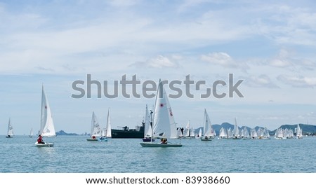 CHA-AM THAILAND - AUGUST 22: Group of unidentified sailors from Thailand compete on Day 1 of the 2011 Hua Hin Regatta on August 22, 2011 at Dusit Thani Resort & Spa Hua Hin in Cha-Am, Thailand