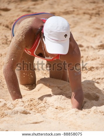 PHUKET, THAILAND - NOVEMBER 3: Shinako Tanaka of Japan gets disappointed losing a point during a match on day 3 of SWATCH FIVB World Tour 2011 on November 3, 2011 at Karon Beach in Phuket, Thailand