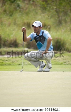 CHONBURI, THAILAND - DECEMBER 15: Charl Schwartzel of South Africa thinks of his next move on Day 1 of Thailand Golf Championship on December 15, 2011 at Amata Spring Country Club in Chonburi Thailand