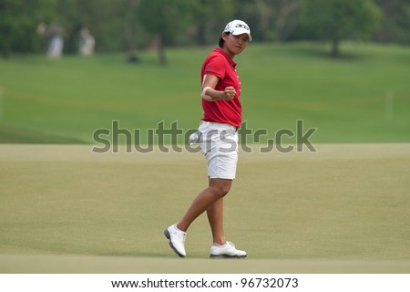 PATTAYA, THAILAND-FEBRUARY 17: Yani Tseng of Taiwan celebrates a point during Round 2 of Honda LPGA 2012 on February 17, 2012 at Siam Country Club Old Course in Pattaya, Thailand