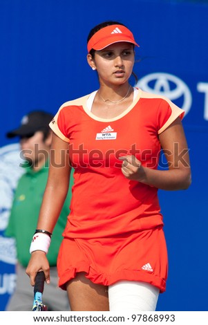 PATTAYA THAILAND - FEBRUARY 9: Sania Mirza of India reacts after winning a point during Round 2 of PTT Pattaya Open 2012 on February 9, 2012 at Dusit Thani Hotel in Pattaya, Thailand