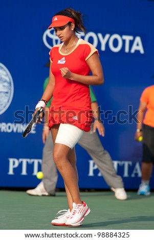 PATTAYA THAILAND - FEBRUARY 9: Sania Mirza of India reacts after winning a point during Round 2 of PTT Pattaya Open 2012 on February 9, 2012 at Dusit Thani Hotel in Pattaya, Thailand