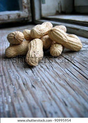 Peanuts in the shell on an old retro window sill