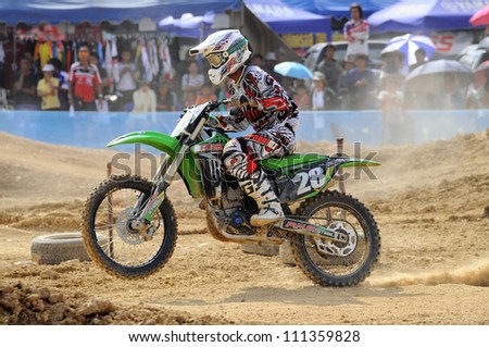 NAN, THAILAND - JUN 03: An unidentified rider participates in the 3rd round (Class A Type) of Motocross 2012 Thailand motocross championship on June 03, 2012 in Nan Province, Thailand.