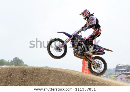 NAN, THAILAND - JUN 03: An unidentified rider participates in the 3rd round (Class A Type) of Motocross 2012 Thailand motocross championship on June 03, 2012 in Nan Province, Thailand.