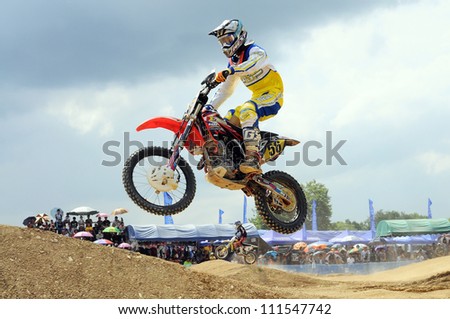 NAN, THAILAND - JUN 03: An unidentified rider participates in the 3rd round (Class C Type) of Motocross 2012 Thailand motocross championship on June 03, 2012 in Nan Province, Thailand.