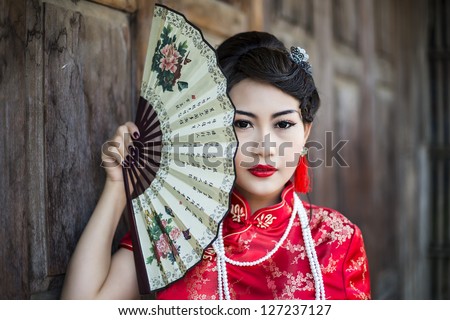 Chinese Girl In Traditional Chinese Cheongsam Blessing
