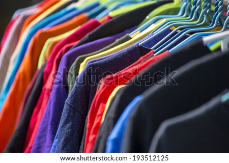 Collection of colored shirts on hangers