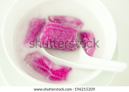 pink color banana in coconut milk,Sweet yellow banana Topped with coconut milk is the famous dessert Thailand
