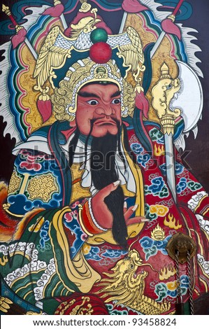 Close up Traditional type of temple gate in China Town Thailand. God of China on the door