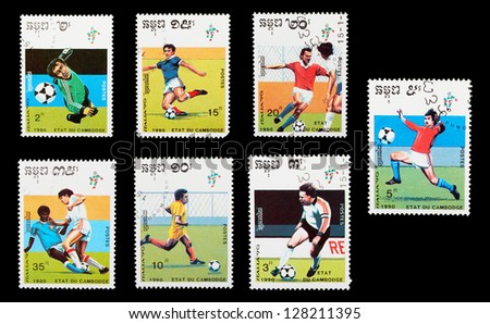 CAMBODIA - CIRCA 1990: A set of postage stamps printed in CAMBODIA shows football players. World football cup in Italy, series, circa 1990