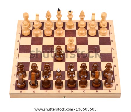 The wooden chess pieces on a chess board isolated on a white background