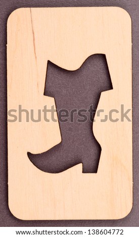wooden stencil in the form of boot