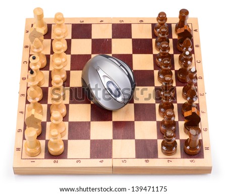 The wooden chess pieces and computer mouse on a chess board isolated on a white background