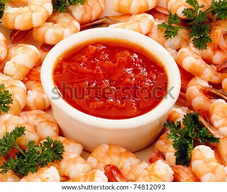 shrimp with sauce in the background