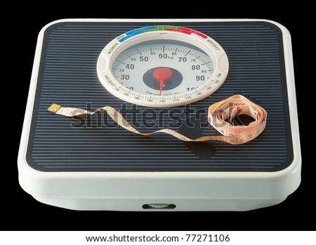 A professional weight scale on a black background.