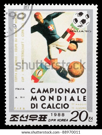DPR KOREA - CIRCA 1988: a stamp printed by DPR KOREA shows football players. World football cup in Italy, series, circa 1988