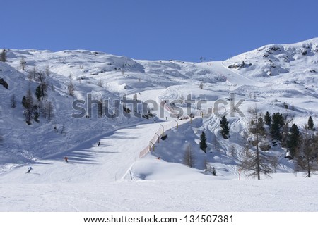 Col Margherita ski run, San Pellegrino pass; ski run in Dolomites in white landscape, shot under deep blue sky