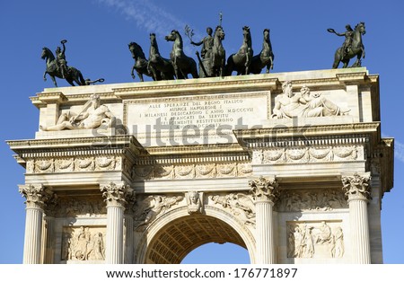 Arco della Pace upper part, Milan; detail of upper part of marble monument  originally built to celebrate the arrival of Napoleon in town in 1807, shot  in bright winter light