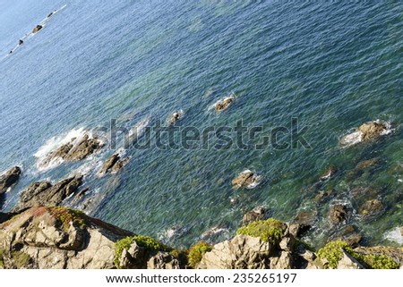 cliffs and waves at Lizard point, Cornwall,\
landscape of coastline with cliffs and rocks of touristic location in Cornwall