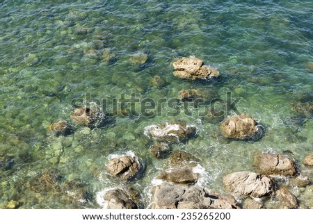 clear water at Lizard point, Cornwall,\
detail of the clear water of the sea between the rocks of touristic location in Cornwall