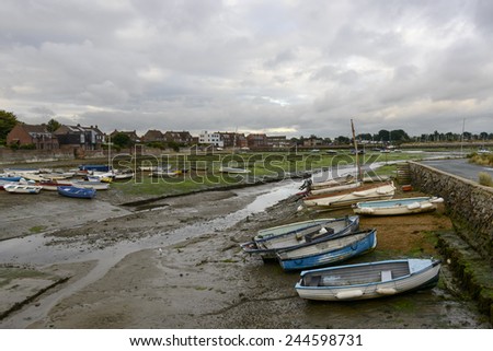 low tide at Emsworth, Hampshire,\
view of the touristic sea village  with boats aground at low tide time
