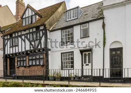 view of old houses in stone and wattle on a street in the historic village of Hastings, East Sussex