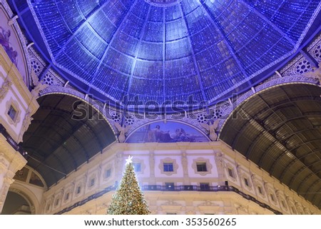 MILAN, ITALY - DECEMBER 8:  in Xmas time the top af a Christmas tree and the high dome of Galleria lightened with small blue lights. Shot on dec 8, 2015 Milan, Italy