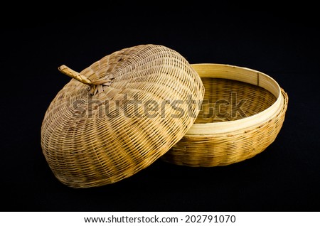Bamboo handicraft casket on black background