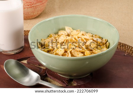 Image of breakfast cereal in green ceramic bowl on brown sack