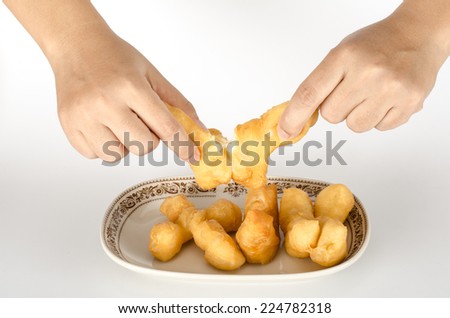 Image of Thai fried dough stick in ceramic dish