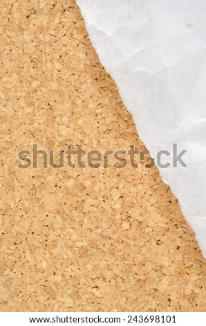 Image of white wrinkle paper ripped on cork background