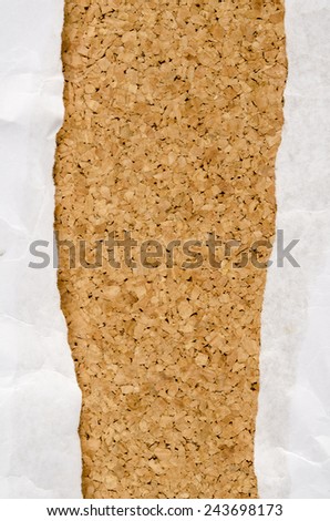 Image of white wrinkle paper ripped on cork background