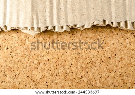 Image of brown Corrugated paper ripped on cork background