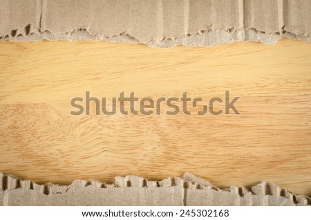 Image of brown Corrugated paper ripped on wood background