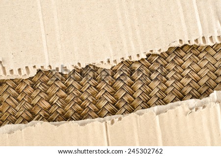 Brown Corrugated paper ripped on bamboo woven background